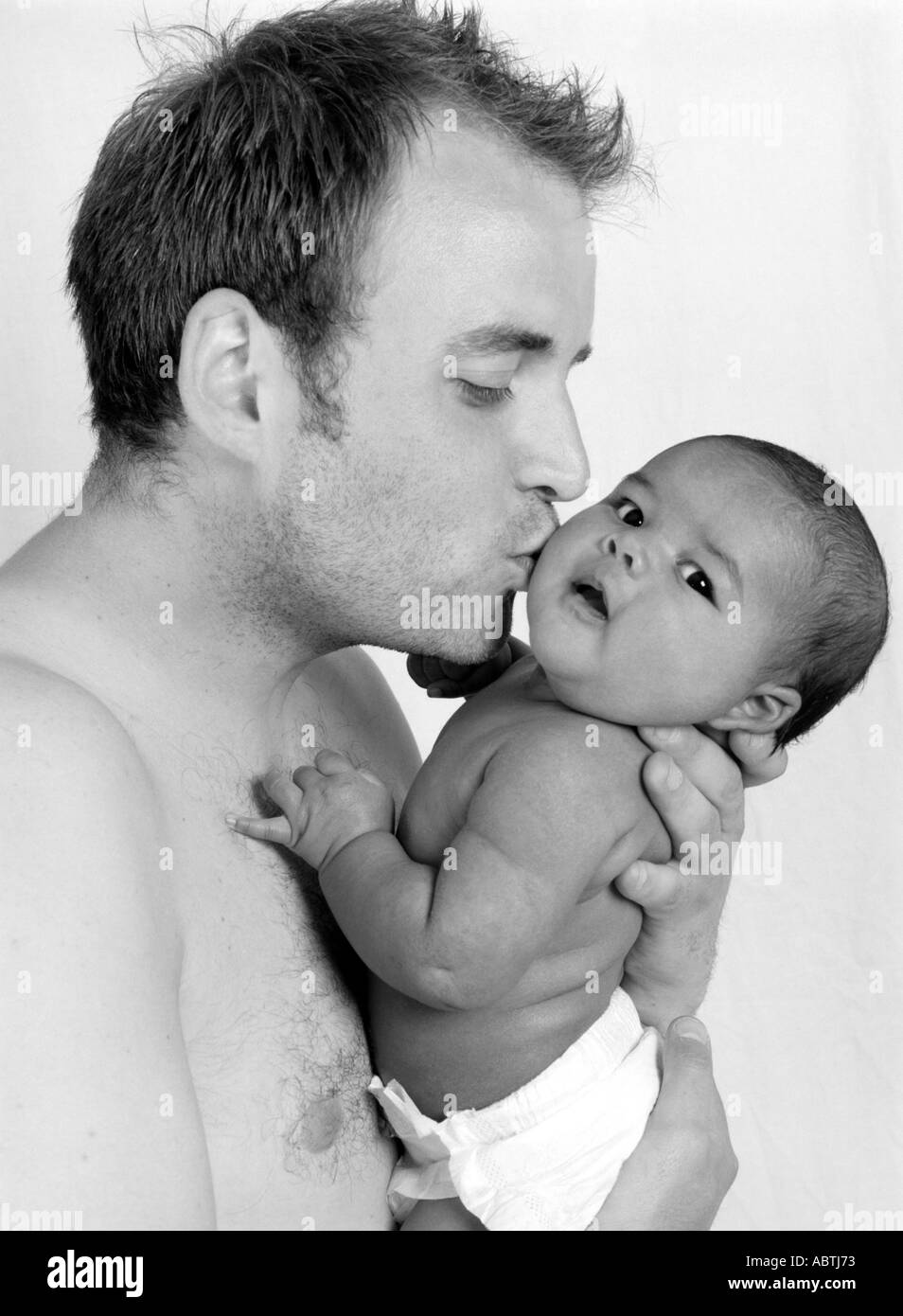 Caucasian Father Playing with his Baby Daughter Stock Photo