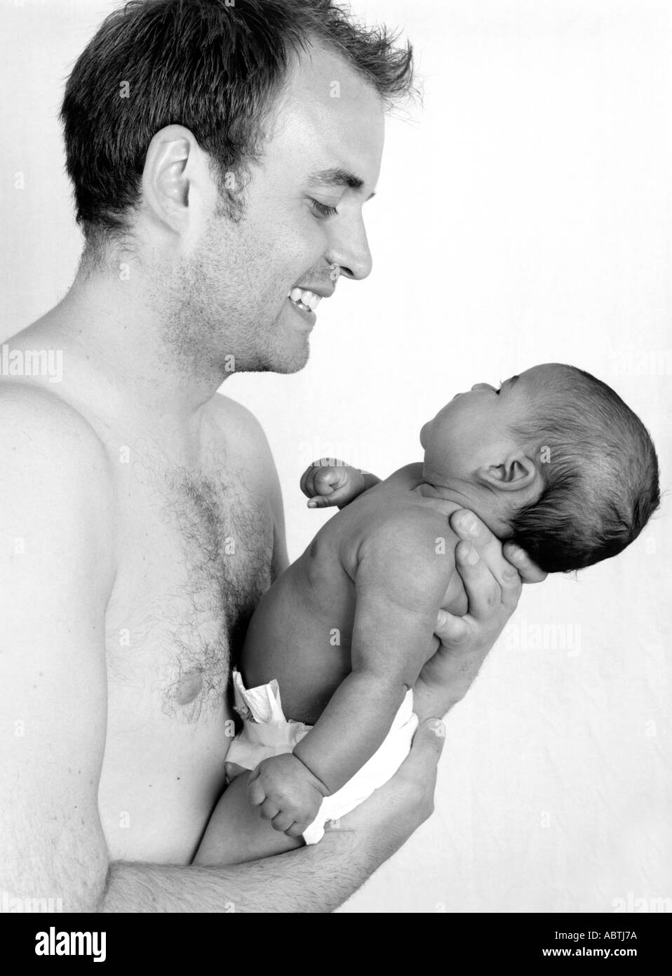 Caucasian Father Playing with his Baby Daughter Stock Photo