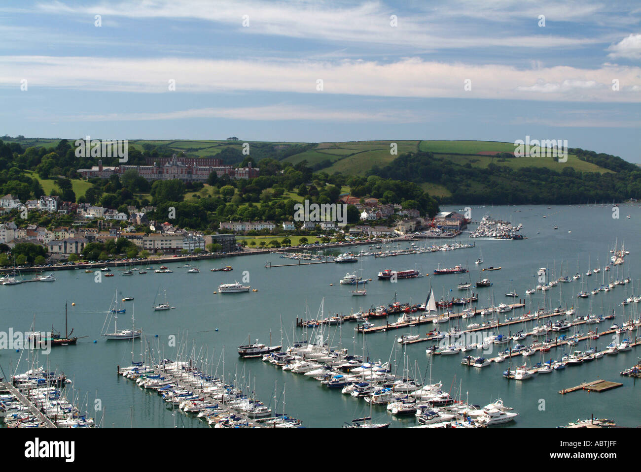 Marina at Kingswear with Brittania Royal Naval College Dartmouth on Hill in Background Devon England United Kingdom UK Stock Photo