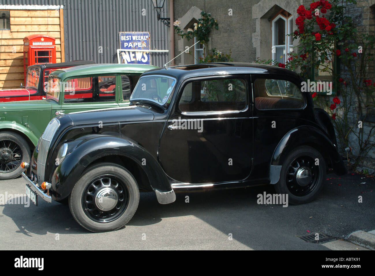 Old Morris 8 with Austin Seven and Convertible in Background at Buckfastleigh Station Devon England United Kingdom UK Stock Photo