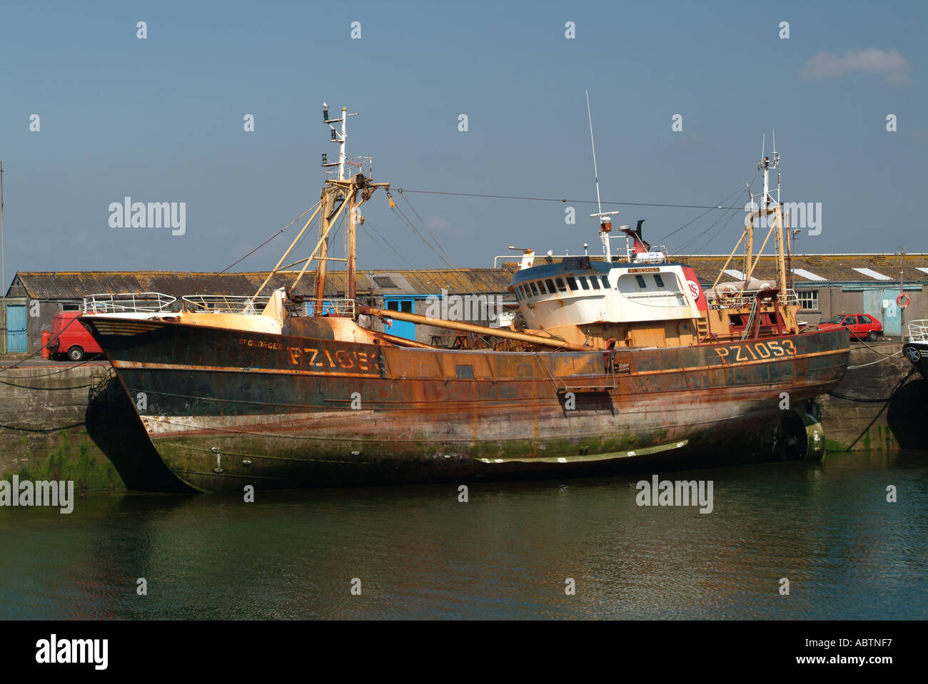 Trawler at Low Tide in Newlyn Harbour Cornwall England United Kingdom UK Stock Photo
