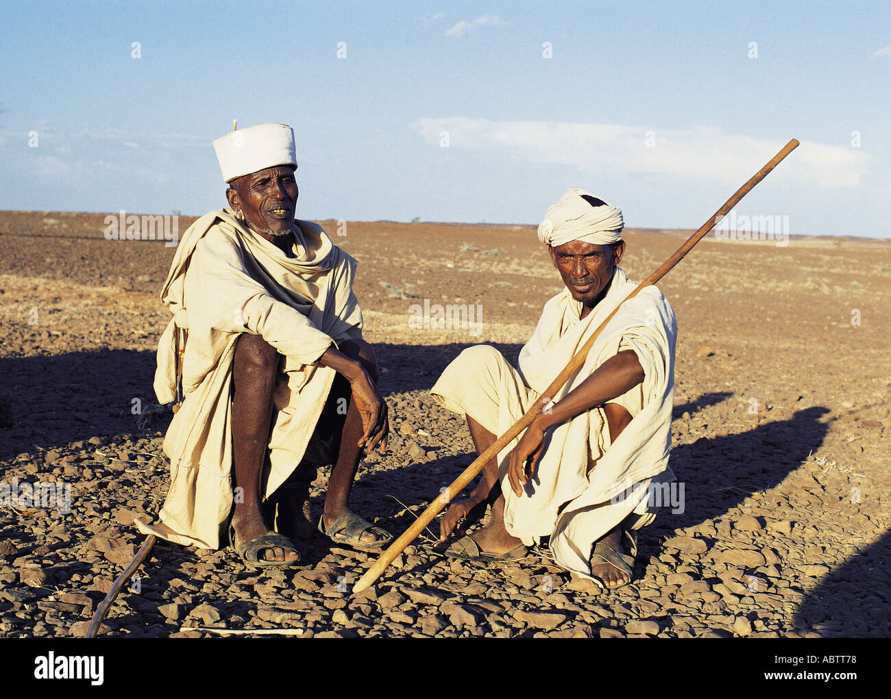 Two Gabbra men sitting and chatting Chalbi Desert northern Kenya Stock Photo