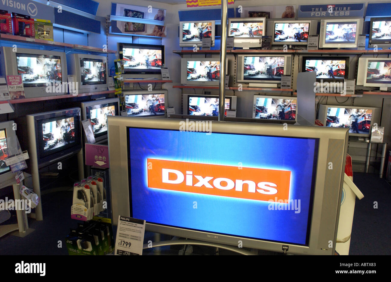 Banks of TV screens in a Dixons store in Brighton Stock Photo