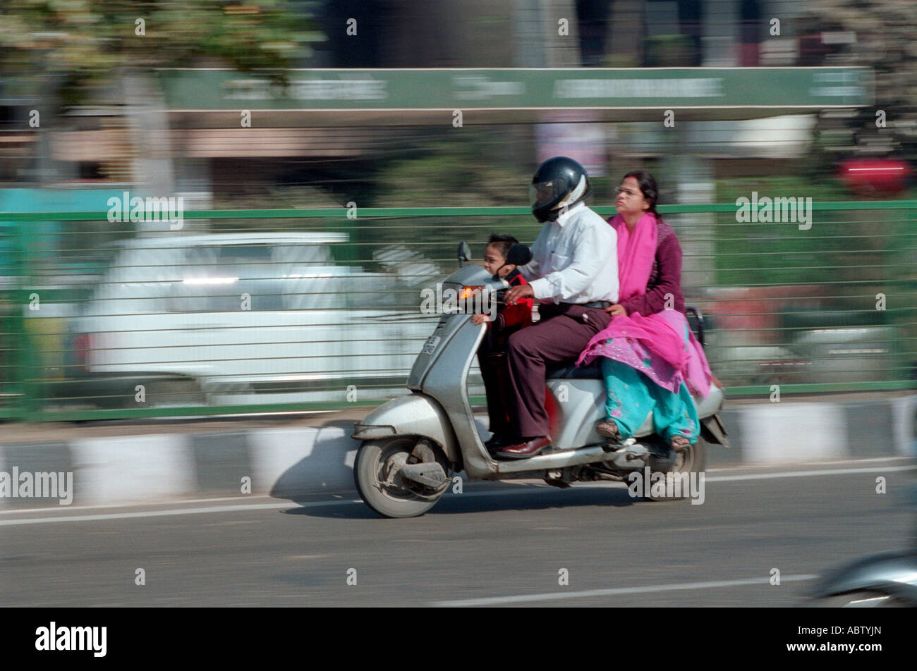 Family travelling on scooter in Delhi, India Stock Photo Alamy