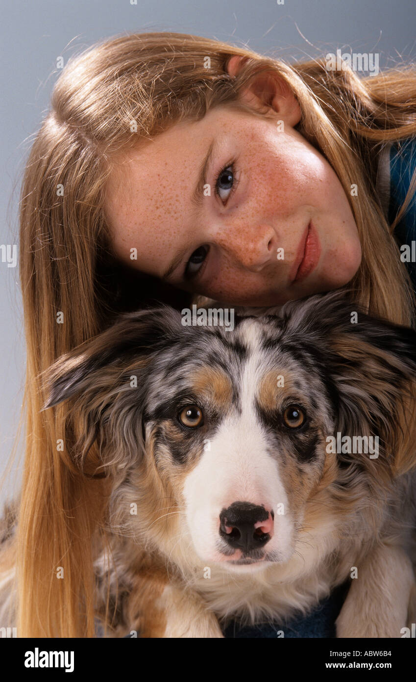 girl and Australian Shepherd dog Stock Photo