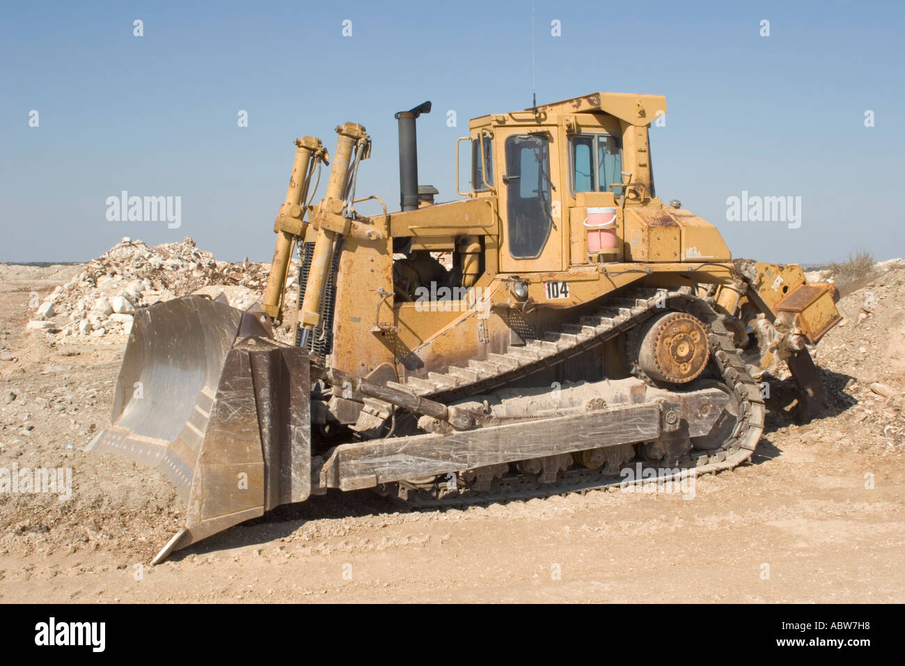 Yellow heavy equipment earth mover bulldozer used in crushed stone