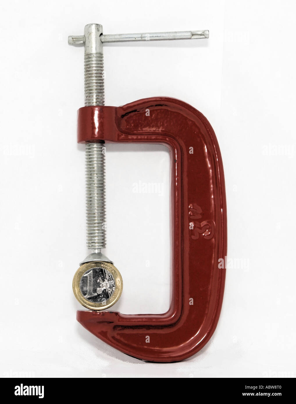 Euro in a red G-clamp. Stock Photo