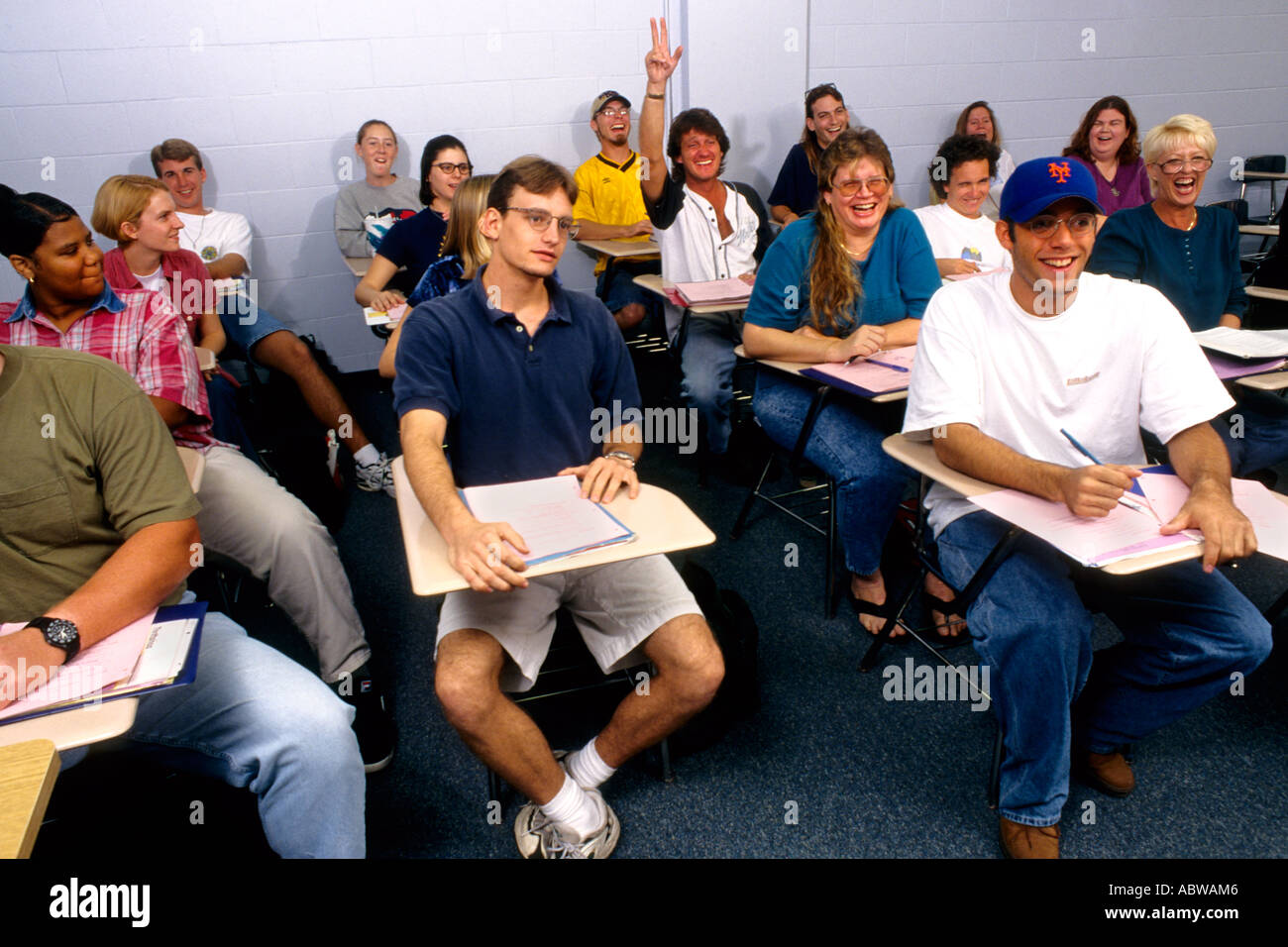 College class with students at desks during lecture Stock Photo
