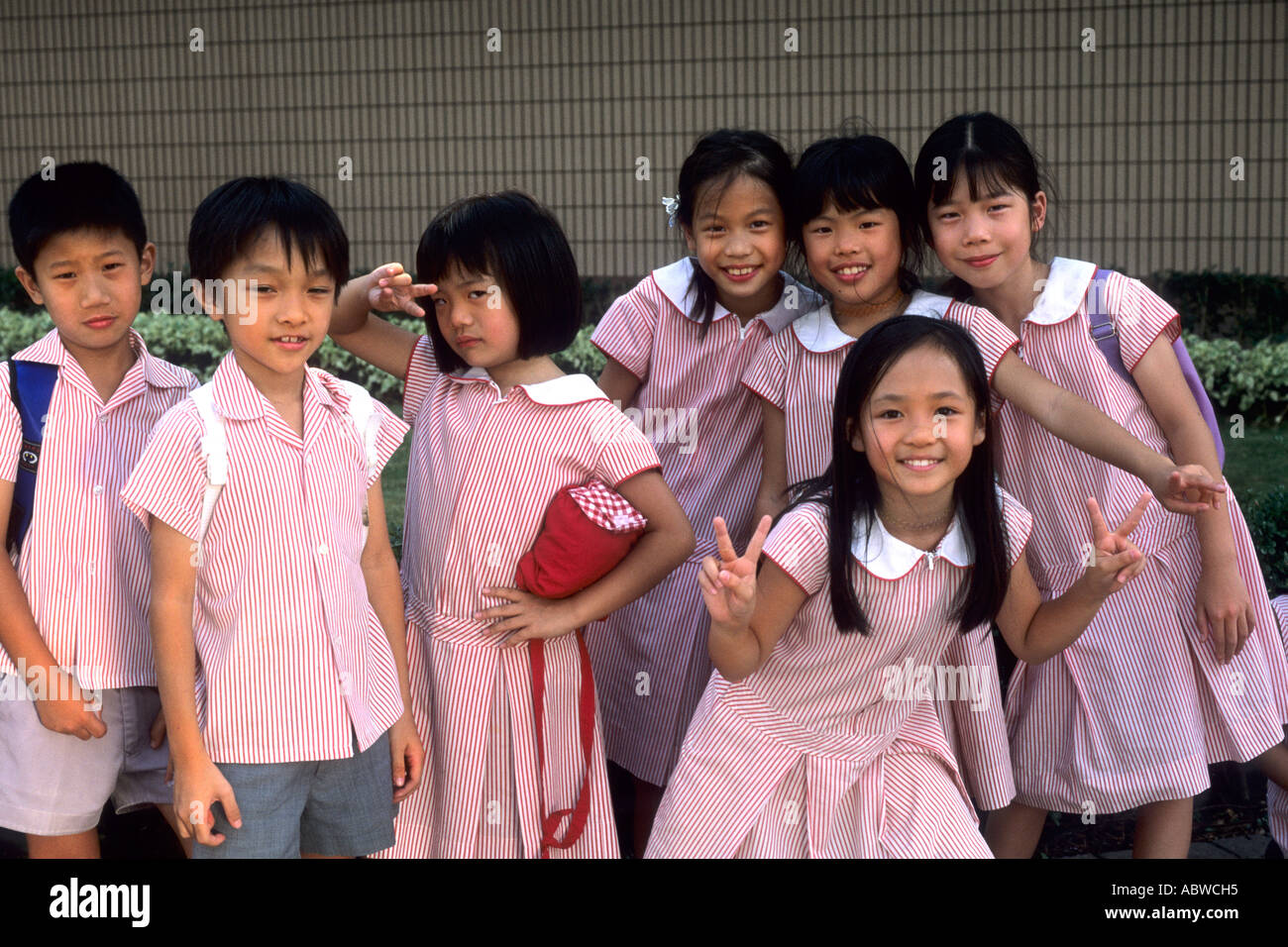 School children age 7 and 8 in Uniform smiling in Hong Kong Island ...