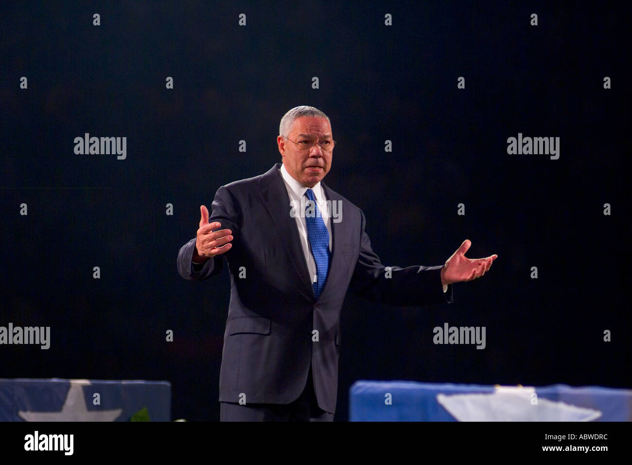General Colin Powell speaking lecture to large crowd during