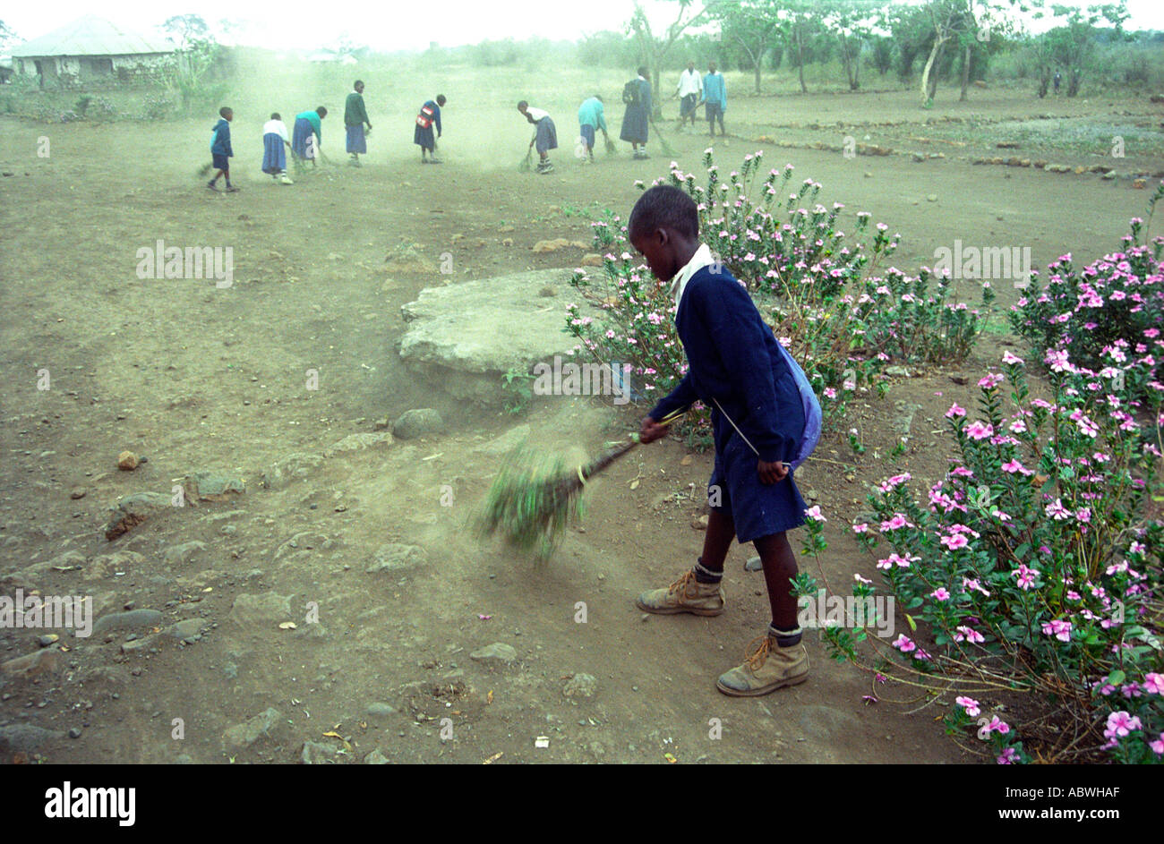 Children clean the playground at Dolly Primary School Usa River Arusha