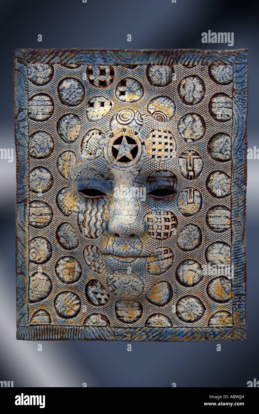 face head bust expression look mask big nose eye brown yellow lattice