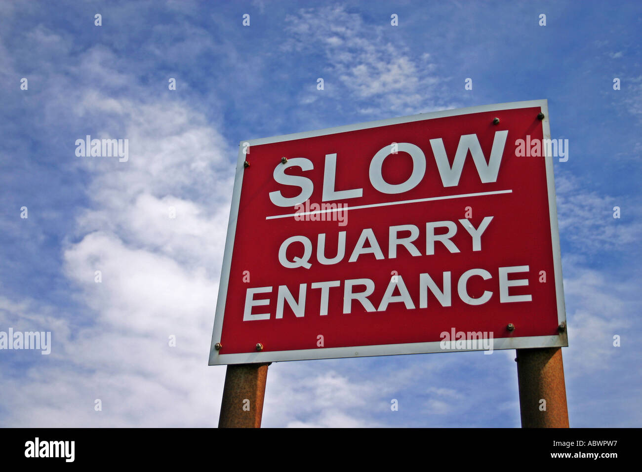 Slow Quarry Entrance warning sign near Longhoughton Northumberland United Kingdom Stock Photo