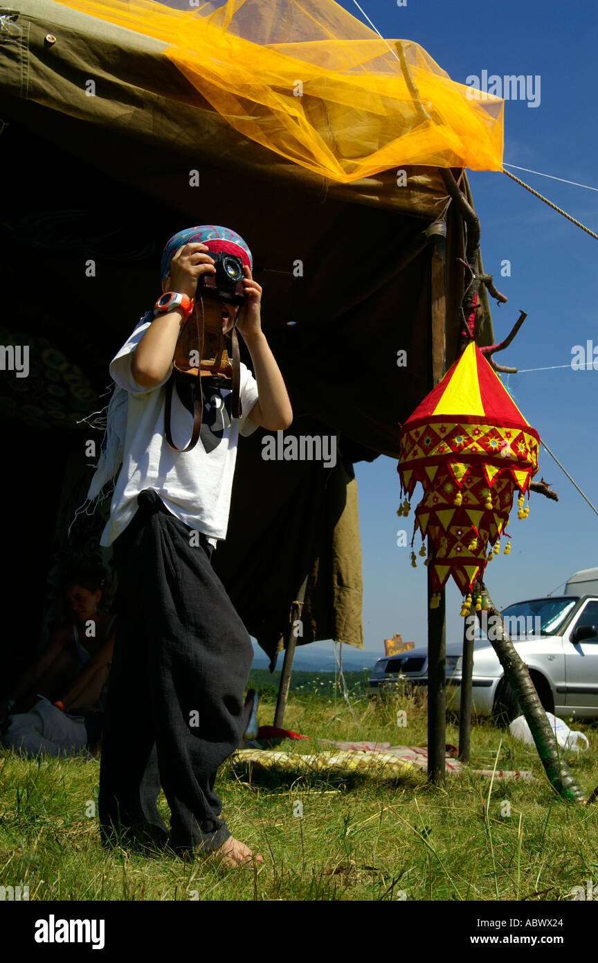 Young boy kid photographer at Lipovec HillTop Festival  rave music outdoors party, Slovakia Stock Photo