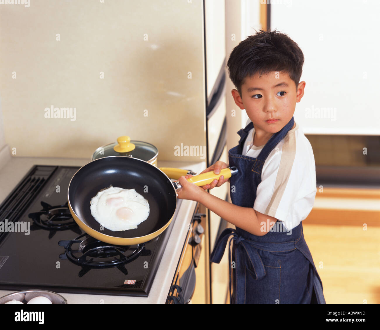 Child cooking stove pan hi-res stock photography and images - Alamy