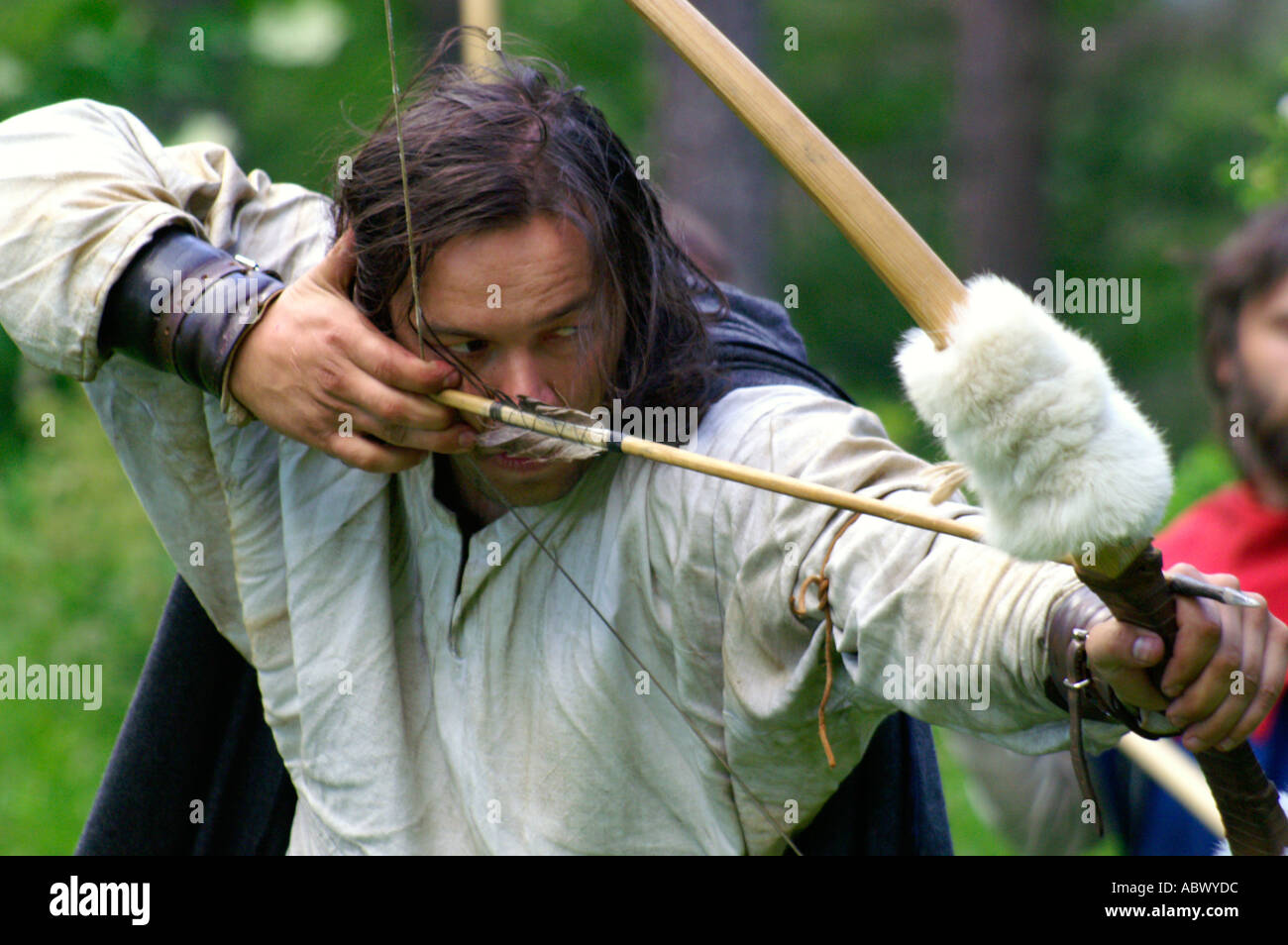 Archer aiming bow and arrow, touch of history Stock Photo Alamy