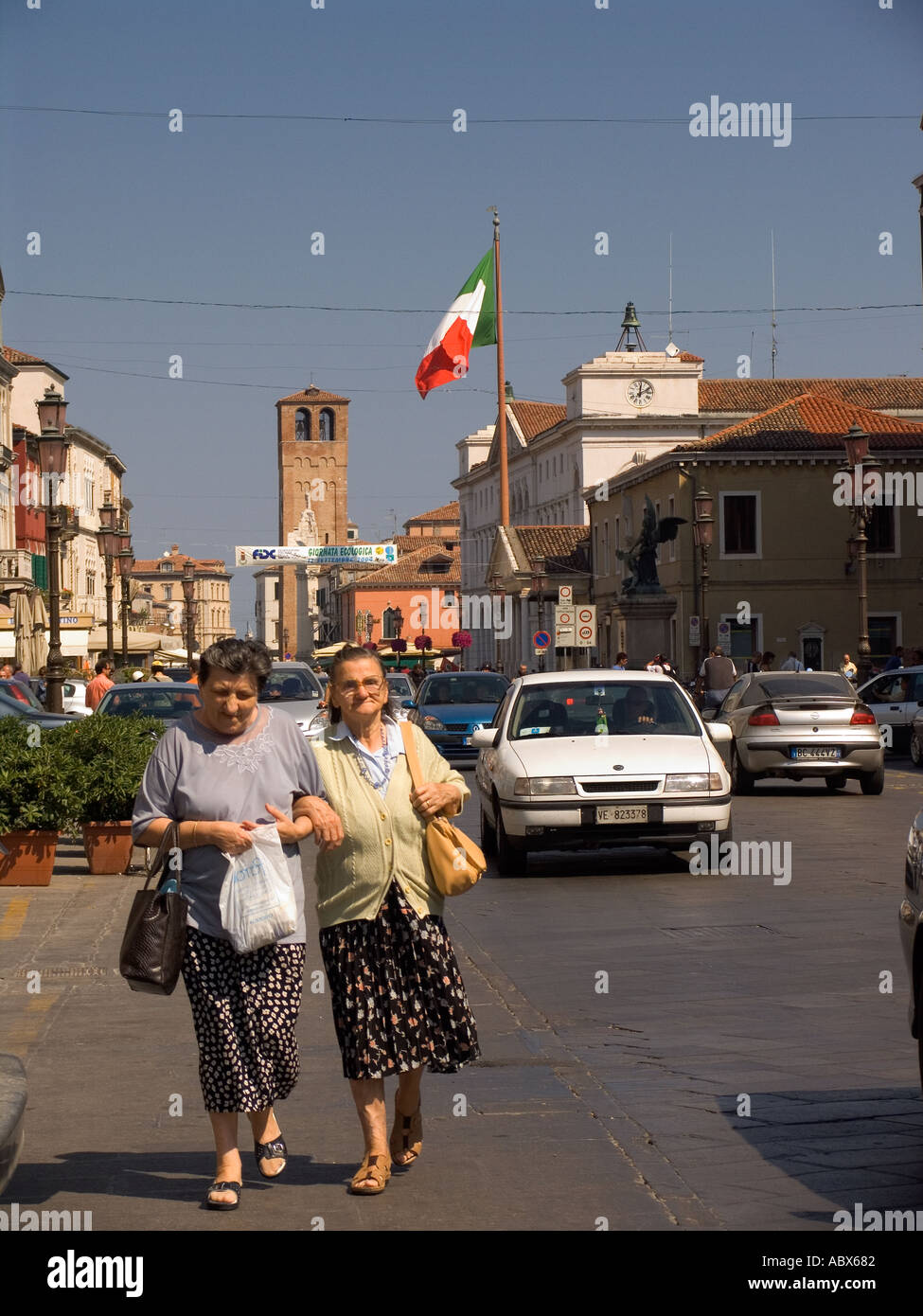 Walking along street arm in arm hi-res stock photography and images - Alamy