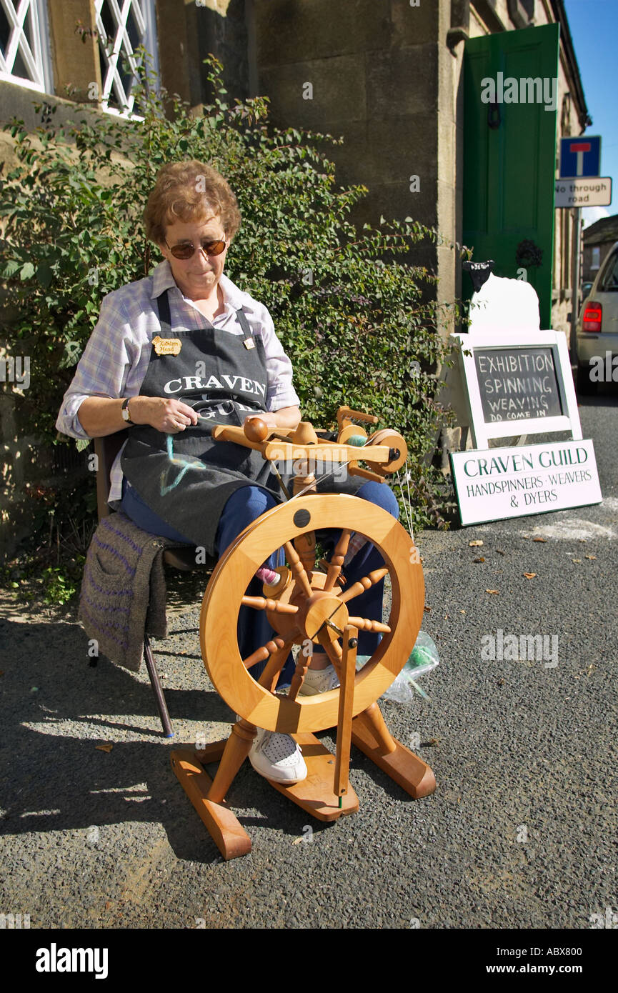 Traditional spinning wheel demonstration at a country fair, UK Stock Photo Alamy