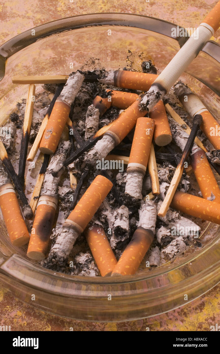 Ash tray full of cigarettes Stock Photo