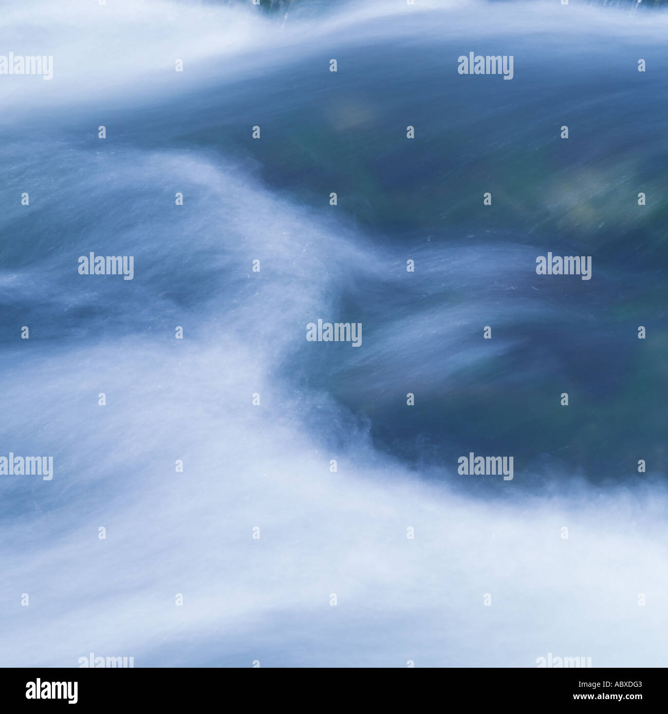Water flowing rapidly in stream Stock Photo - Alamy