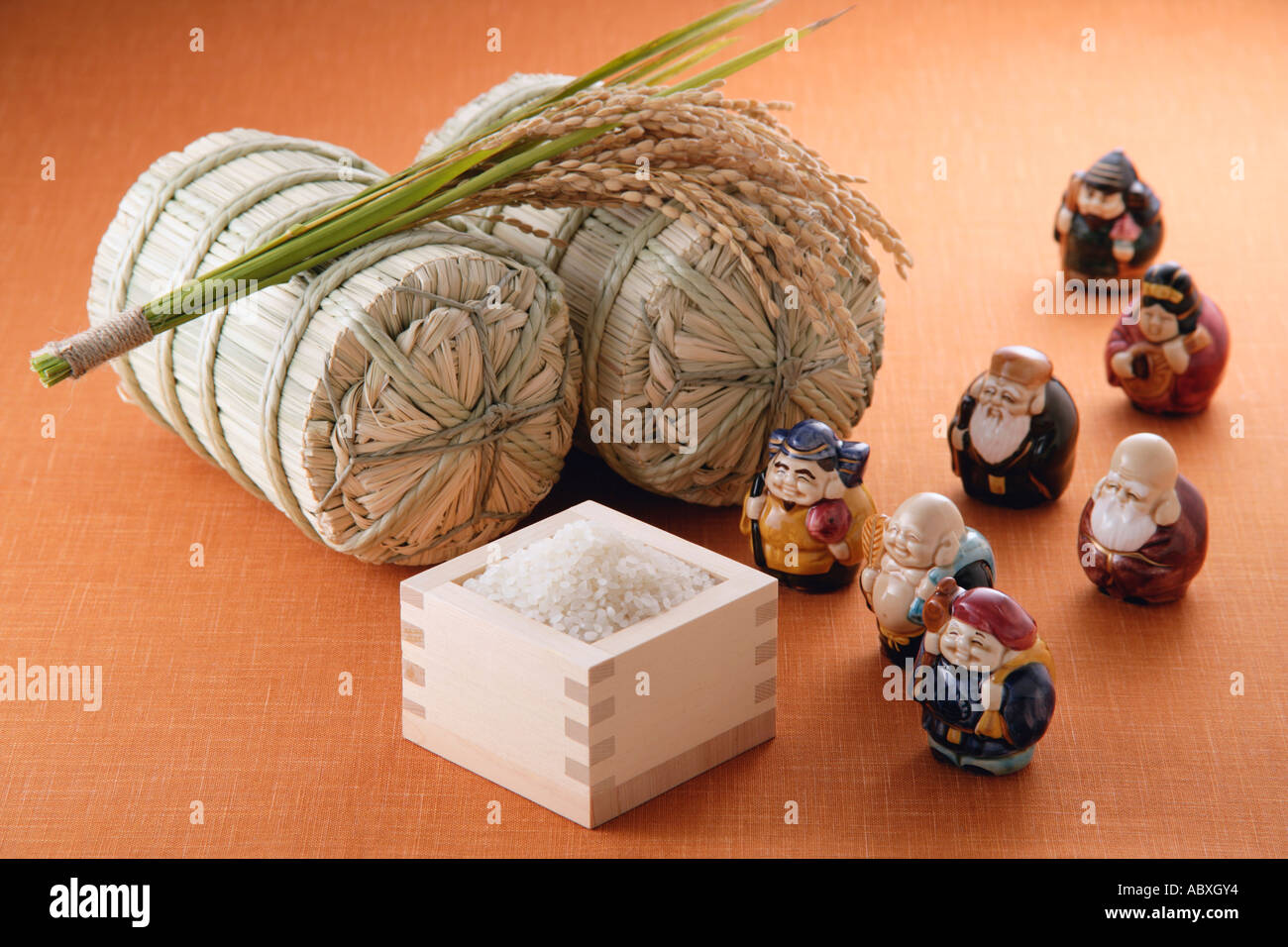 Uncooked rice and figurines Stock Photo