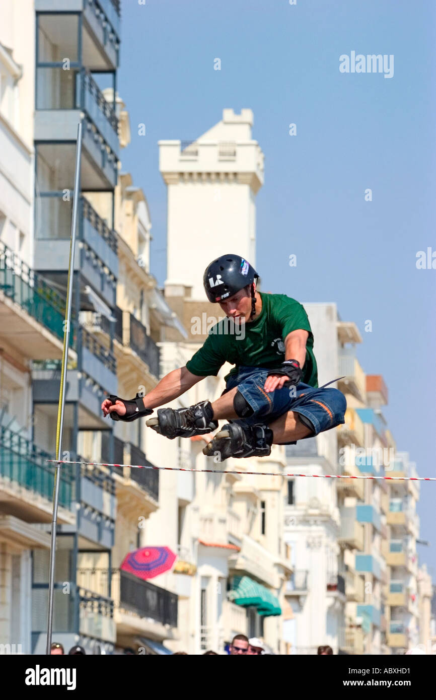 Roller skater jumping a bar Stock Photo Alamy