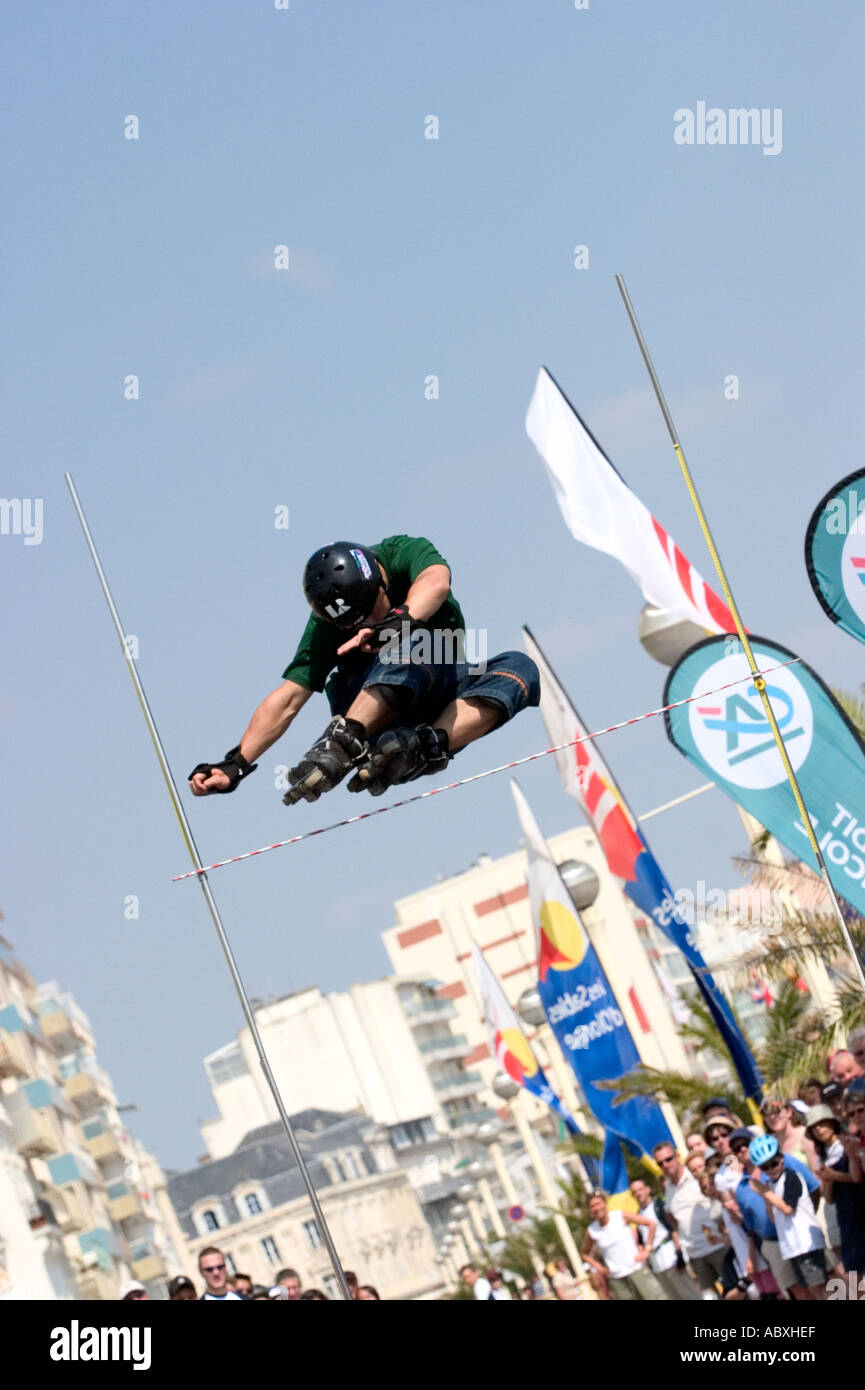 Roller skater jumping high bar Stock Photo Alamy