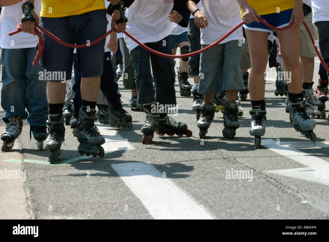 group of people taking a walk with roller in france street Stock Photo