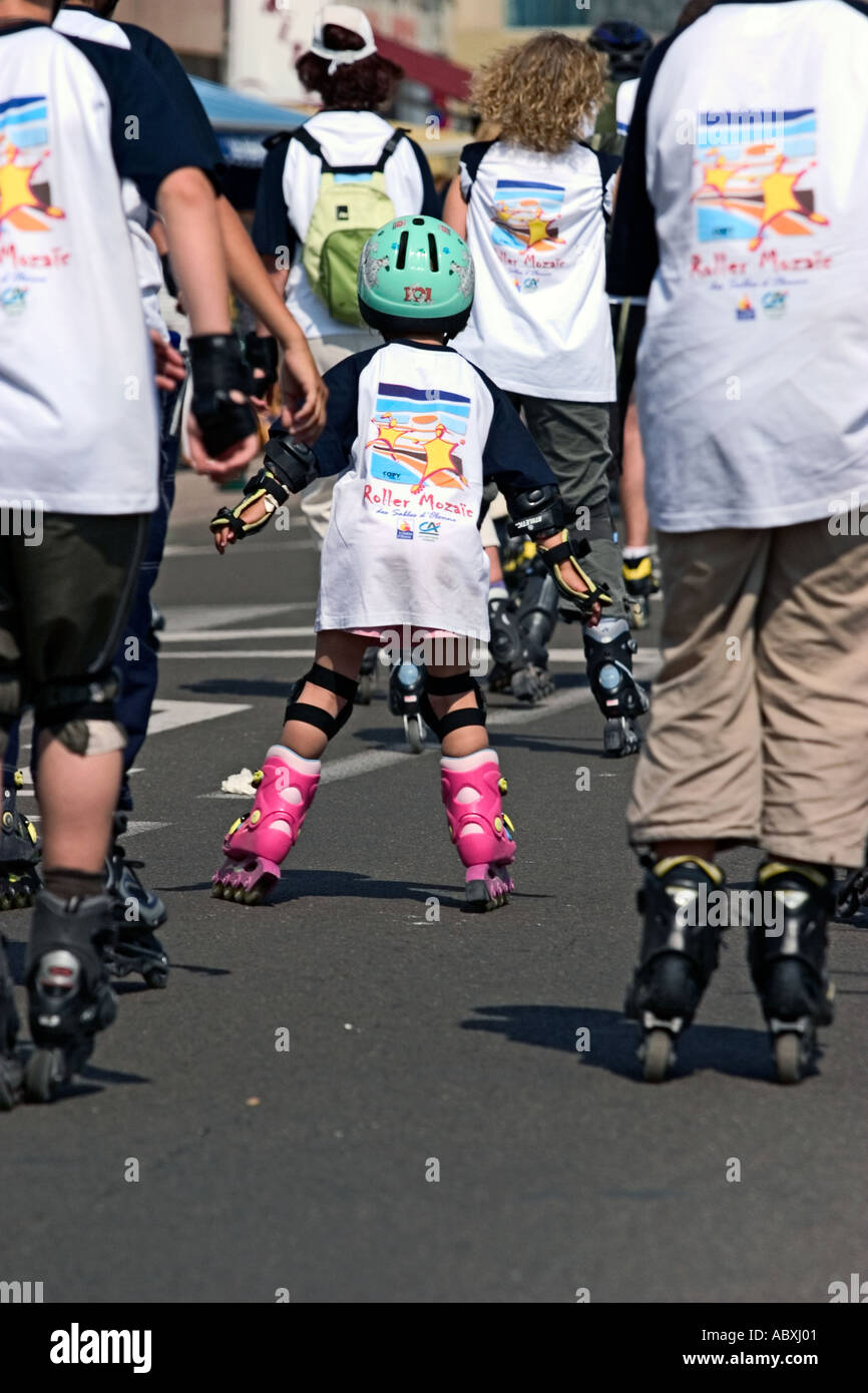 Body Blading kids children roller blading on the street with protection of body ...
