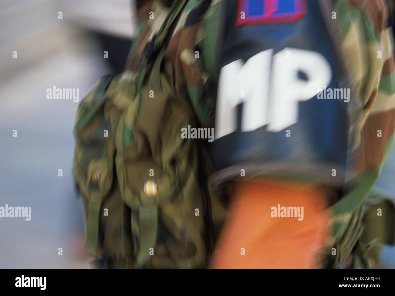 MP armband. American Army Military Police. US Law enforcement in the armed service. uniformed camouflaged soldier, closeup standing at attention. USA Stock Photo