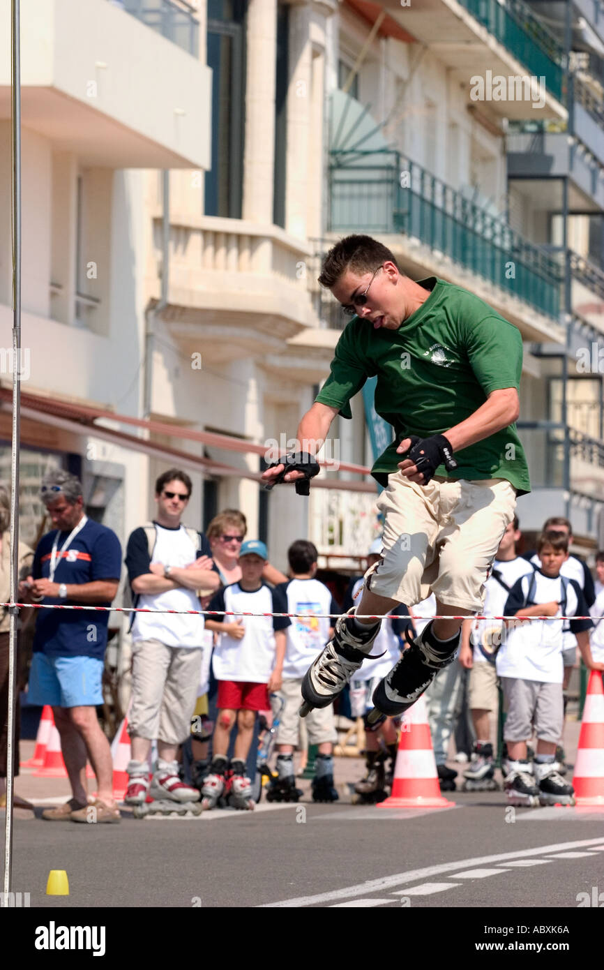 Roller skater jumping high bar Stock Photo Alamy