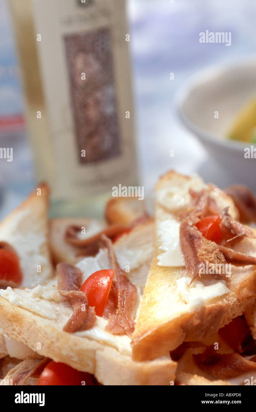Anchovies on toasted bread in Italy. Stock Photo
