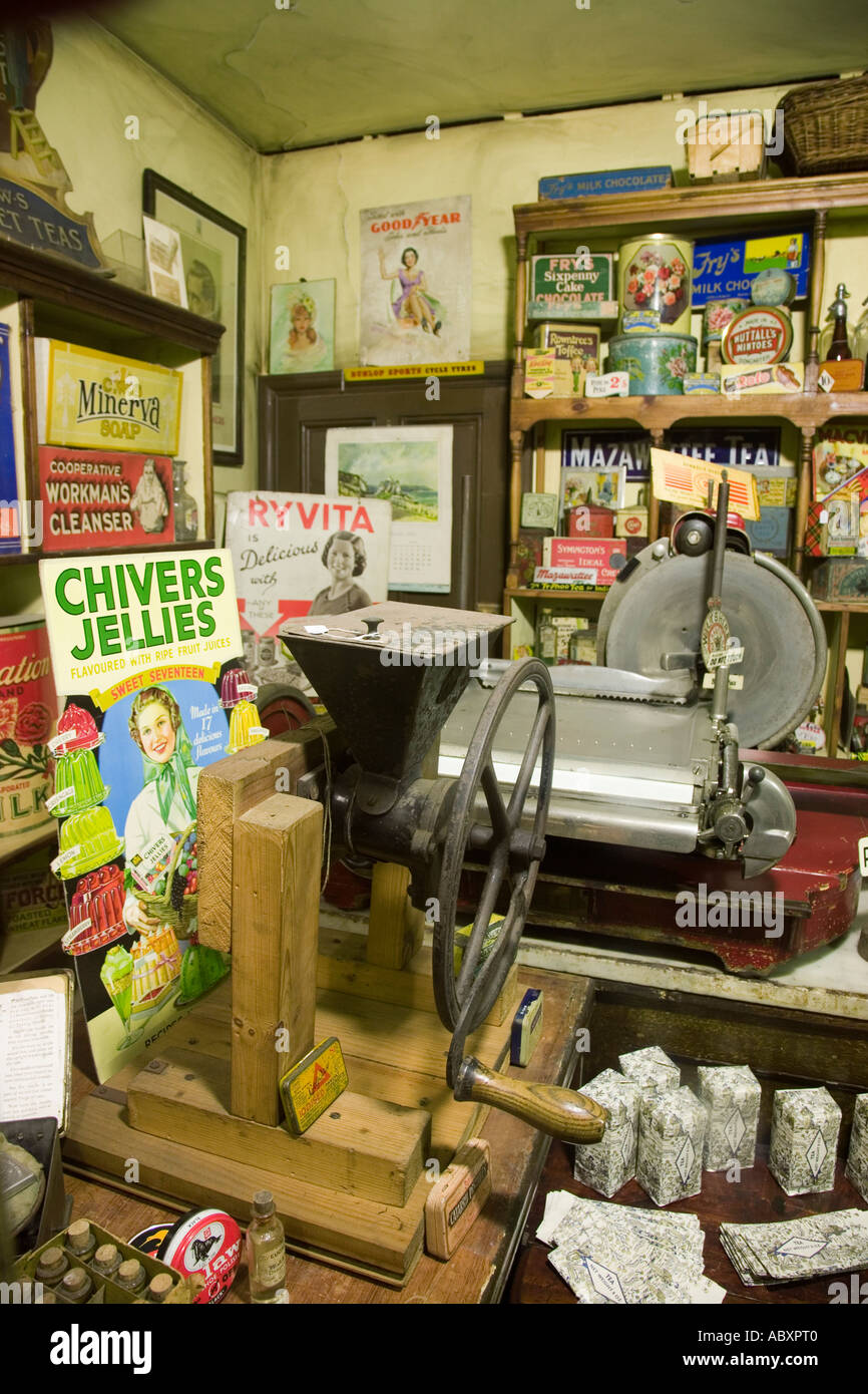 Museum display of 1920s village shop with mincing machine and food posters Wales UK Stock Photo