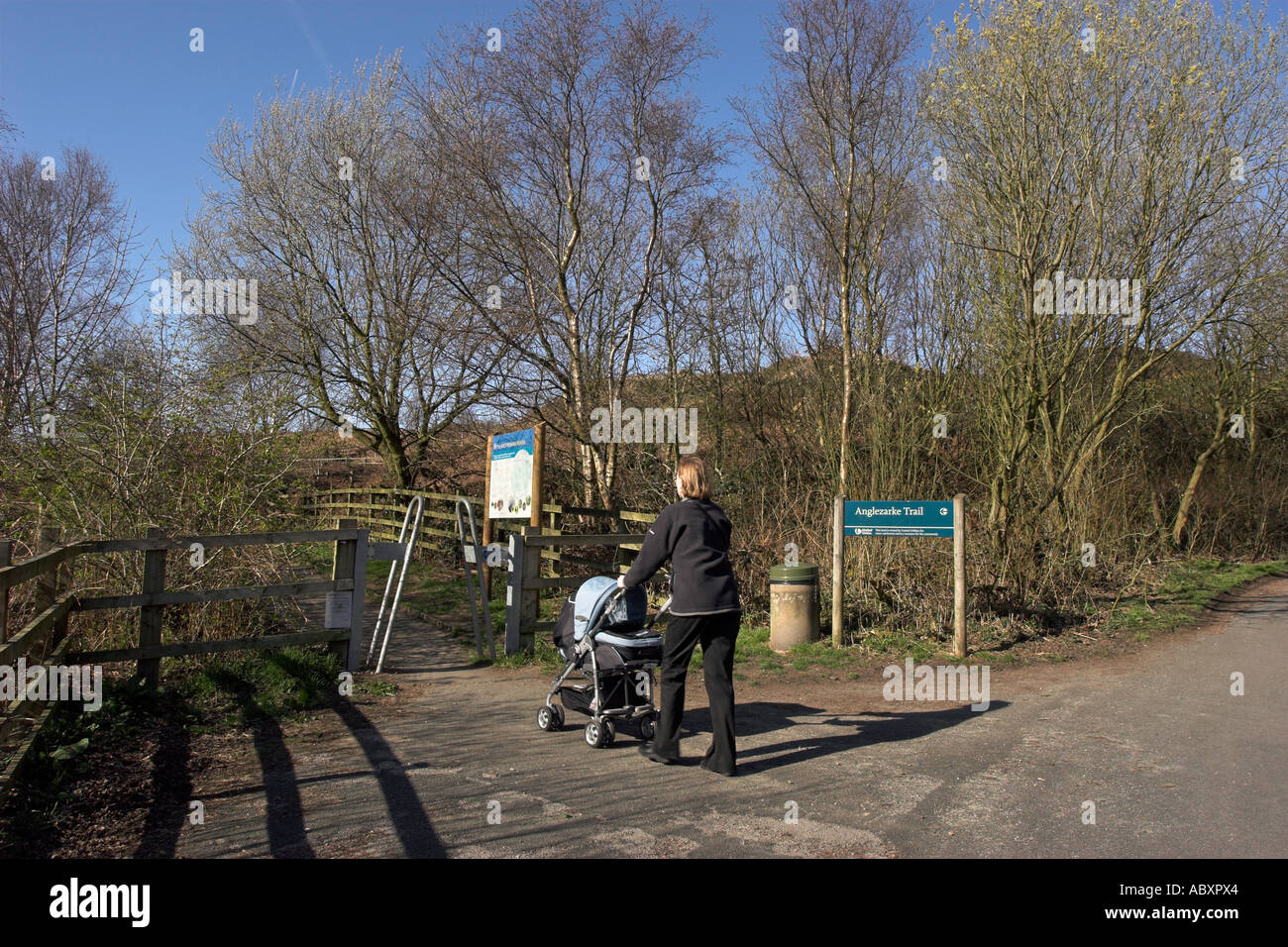 Woman with pram entering the Anglezarke Trail on the West Penine Moors Stock Photo