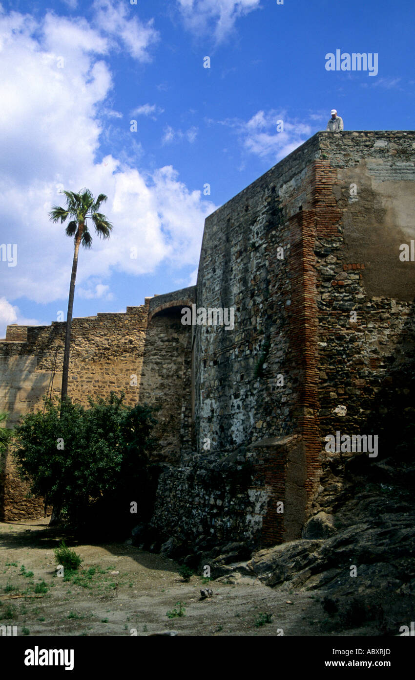 Tourist on the defensive walls of the ancient Castillo de Gibralfaro on the hill above Málaga on the Costa del Sol Spain Stock Photo