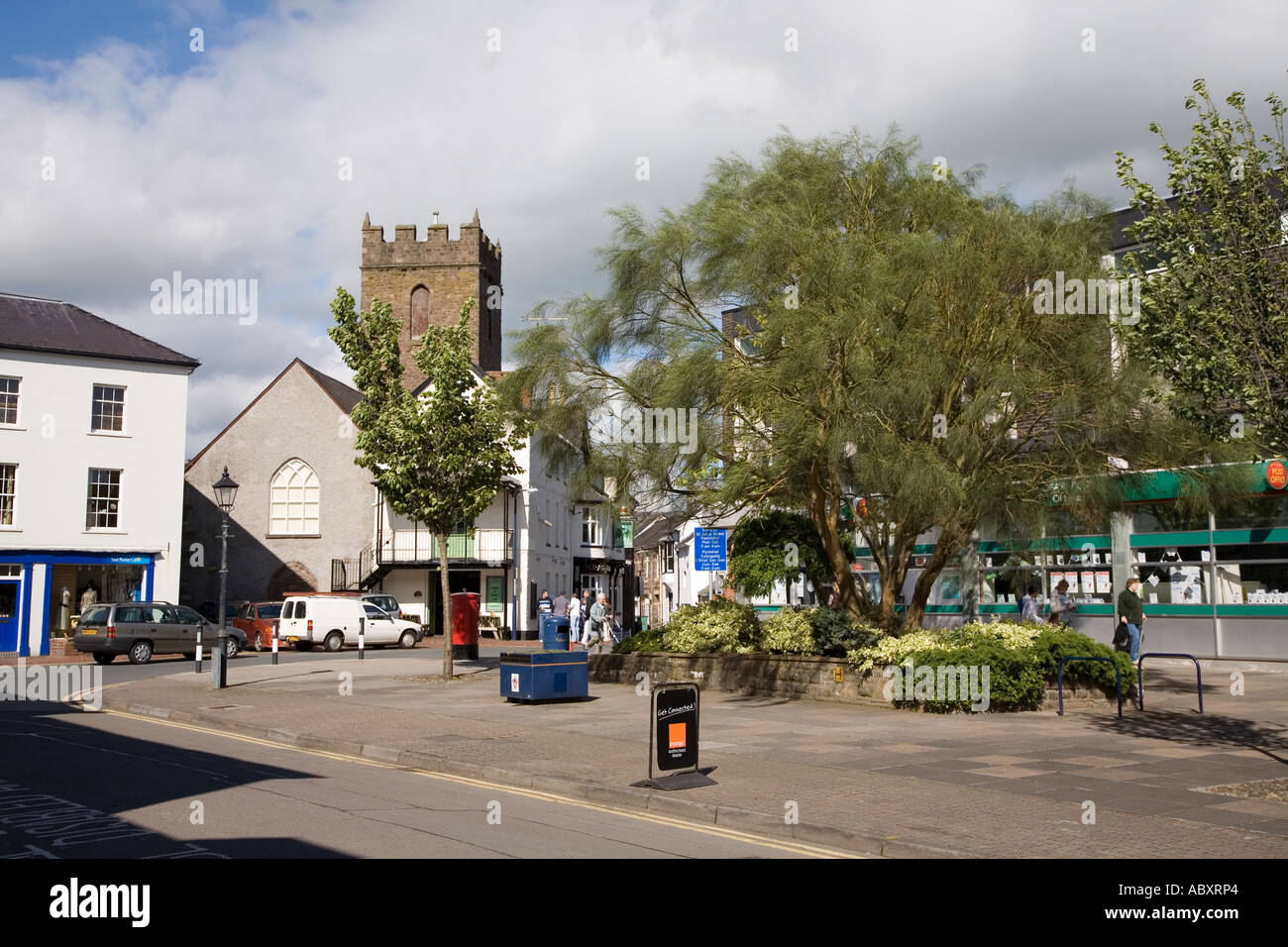 Street scene and broom trees in Abergavenny outside the post office and public houses Wales UK