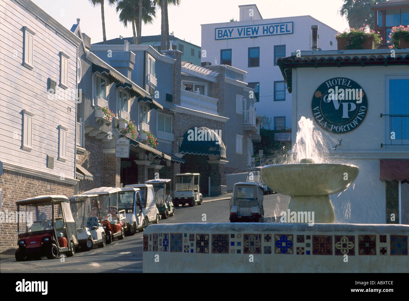 Golf carts used for basic transportation vehicles populate streets of