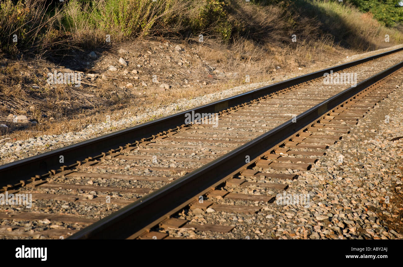 Railroad tracks on a bed of rocks Stock Photo Alamy