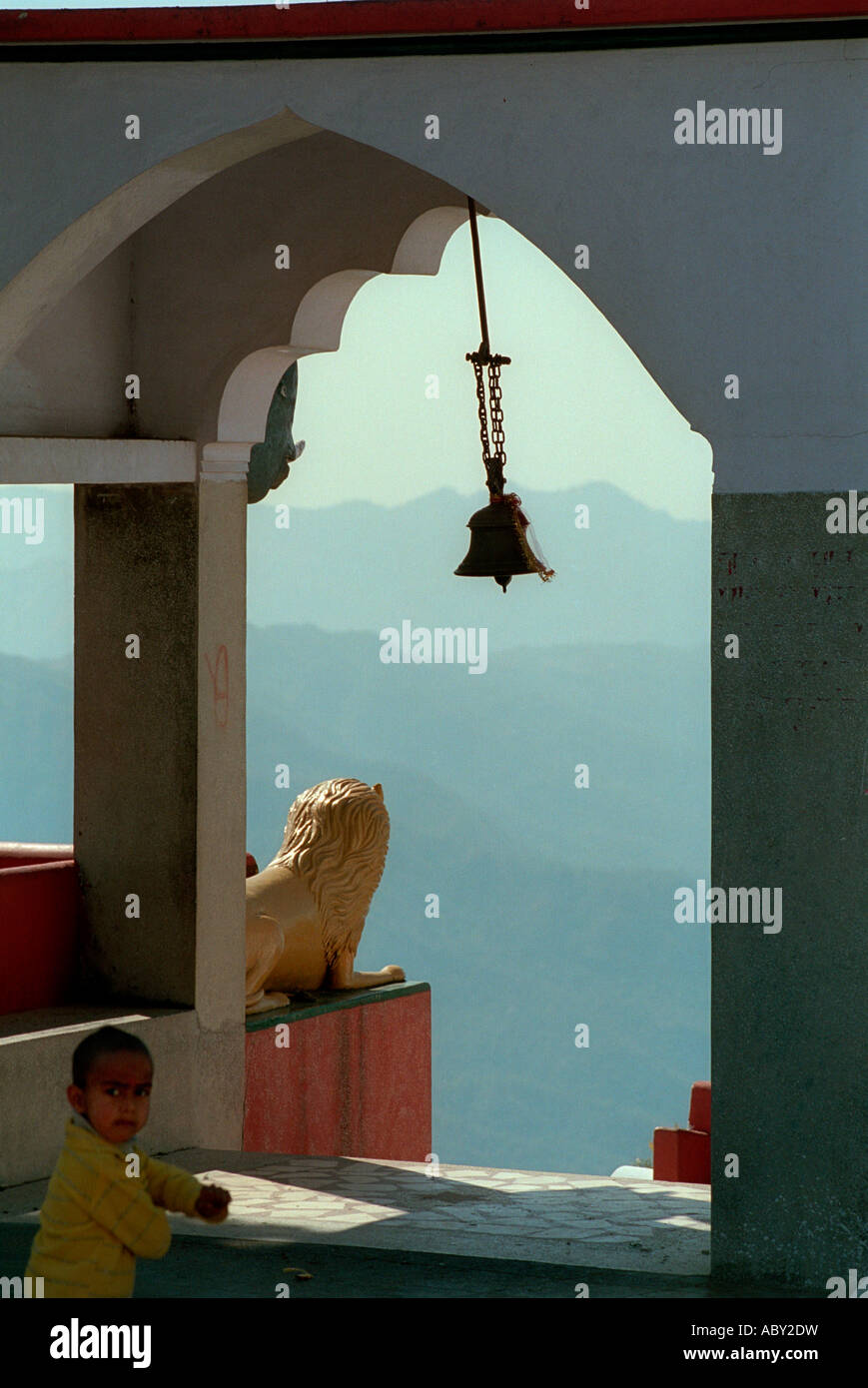 Monastery entrance and bell looking over to the Himalayas in India Stock Photo