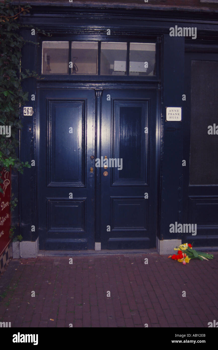 Door to the Anne Frank House in Amsterdam with a floral tribute Stock Photo