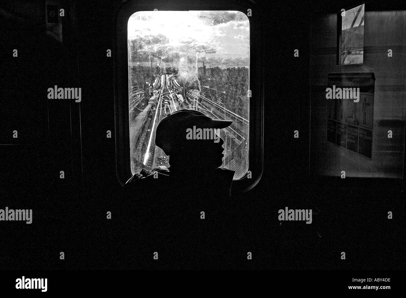 A lone boy at the front car of the 7 train from Queens to Times Square