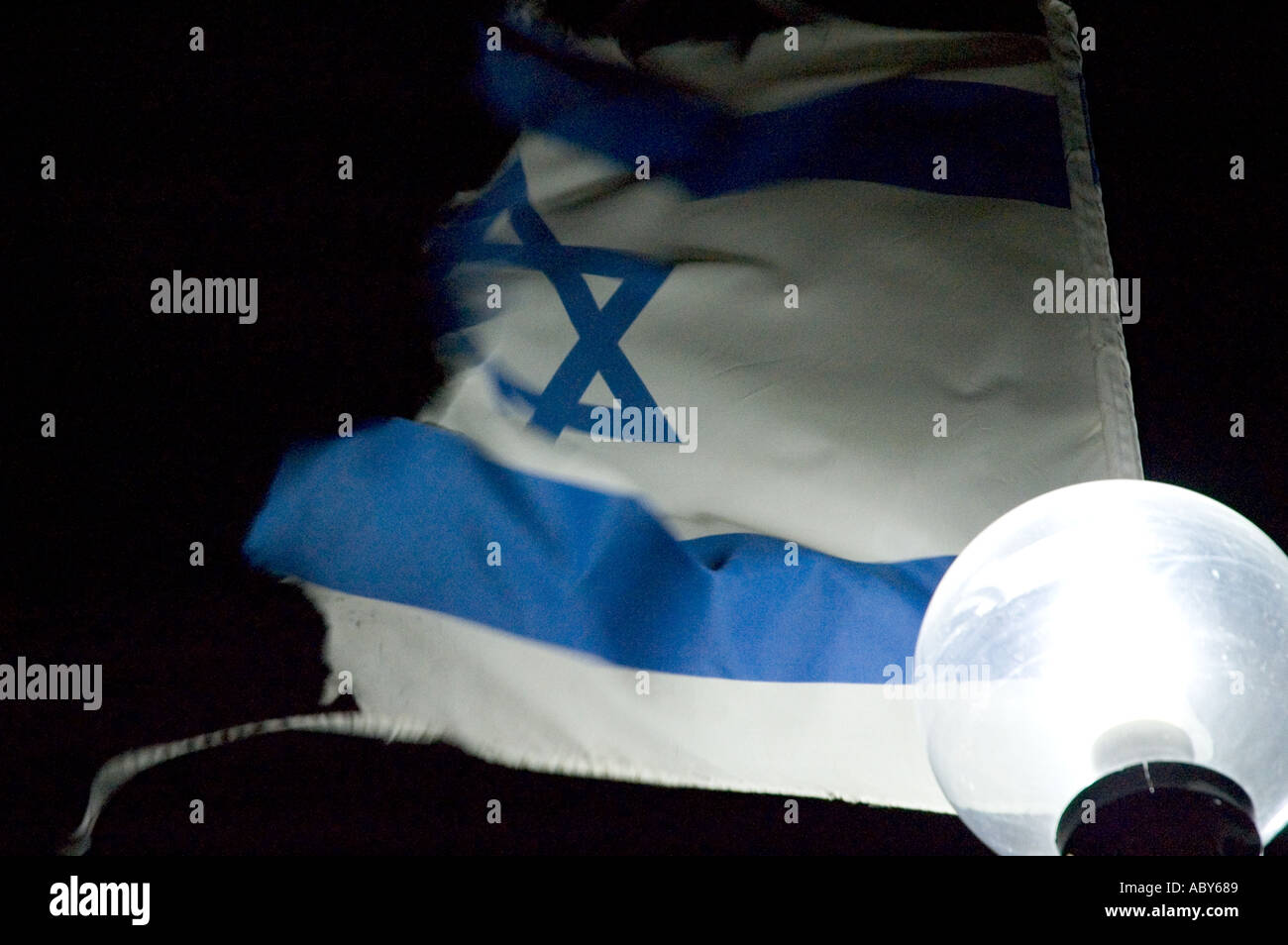 Israel worn out israeli flag flaping in the wind Stock Photo