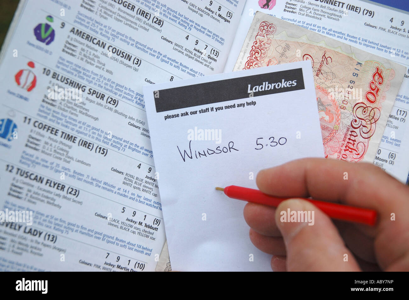 Ladbrokes betting slip and racecard Stock Photo