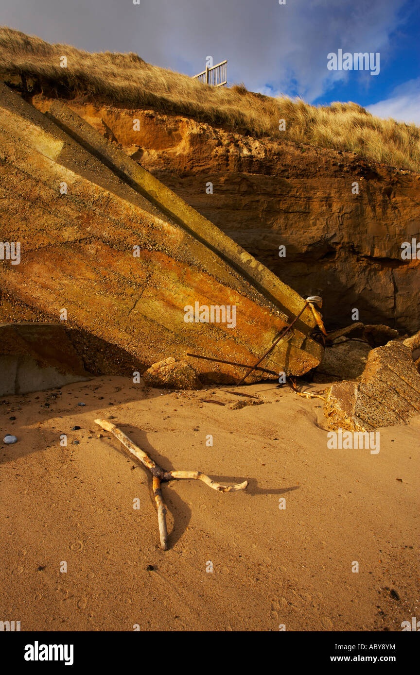 Coastal erosion damage at Happisburgh showing the slope that used to ...