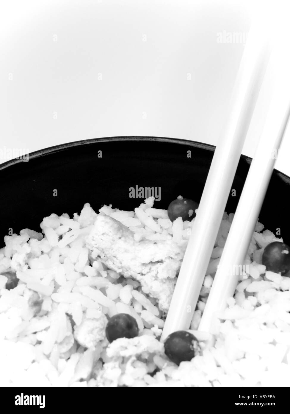CHOPSTICKS IN A BOWL OF CHINESE EGG FRIED RICE Stock Photo
