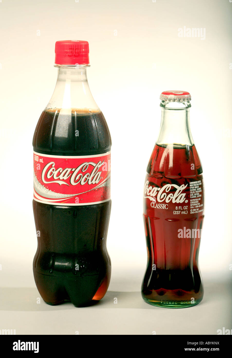 Coke bottles glass and plastic versions Stock Photo