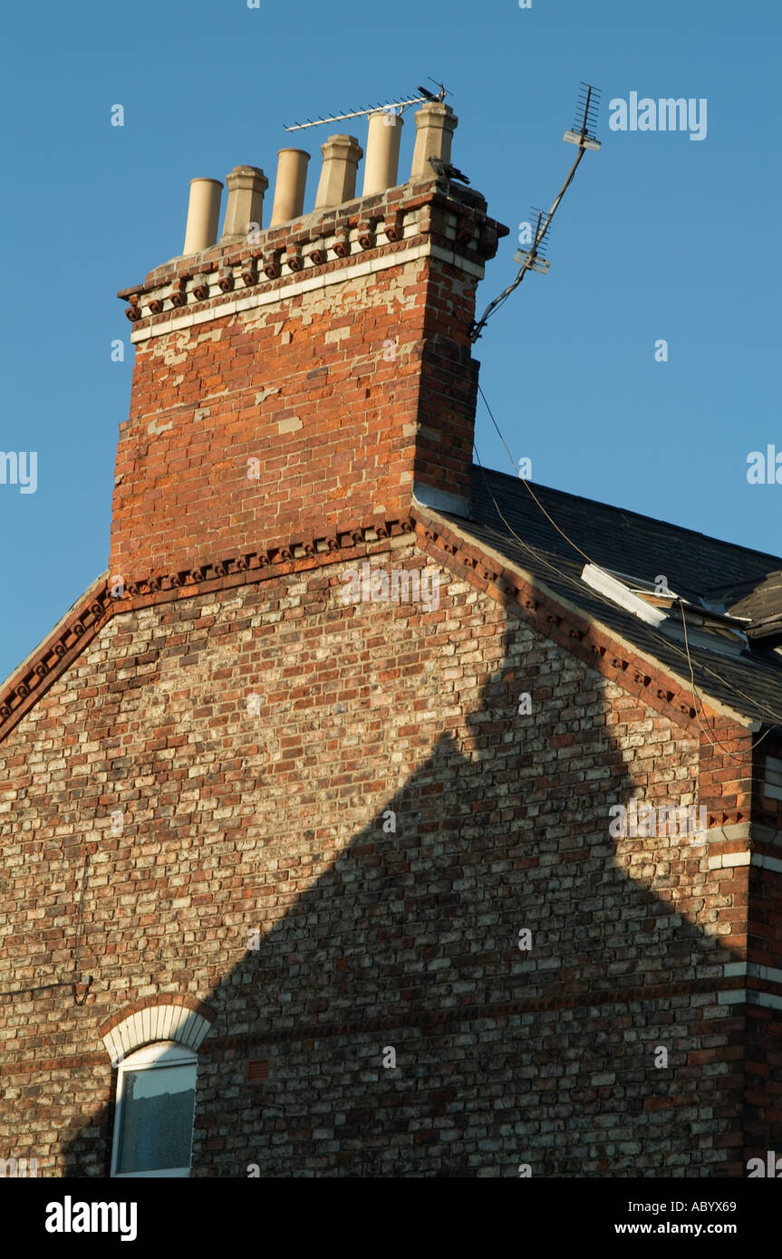 chimney pot pots on large brick built house coal fire smoke feature