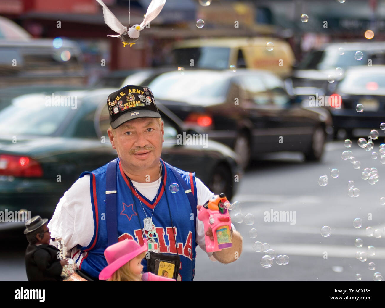 Street vendor and veteran blowing bubbles in New York City, New York. Stock Photo
