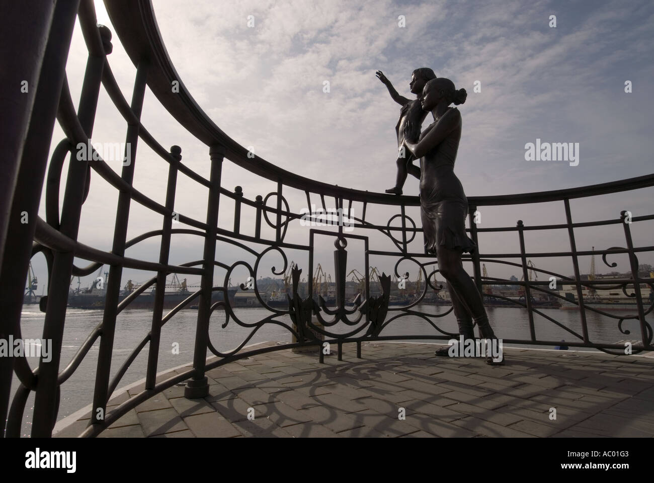 Bronze statue of a wife of a sailor and her child waving out to sea at port Odessa Odesa Ukraine Stock Photo