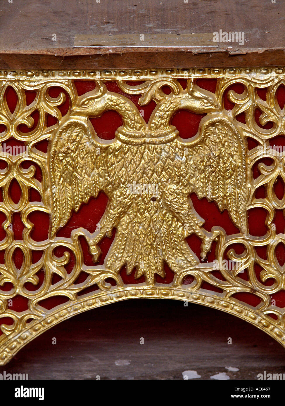 Christian religious image holding furniture with Byzantine eagle symbol detail old church Crete